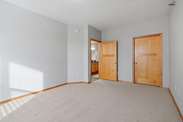 unfurnished bedroom with light carpet