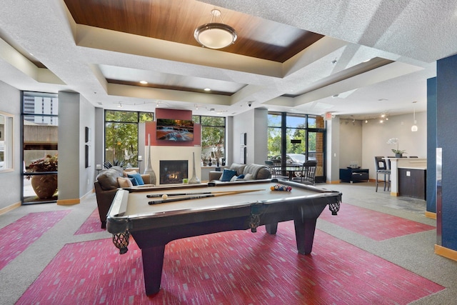 game room featuring carpet floors, billiards, a raised ceiling, and a healthy amount of sunlight