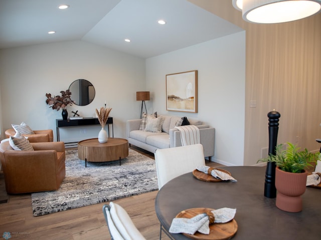 living room featuring hardwood / wood-style floors and lofted ceiling