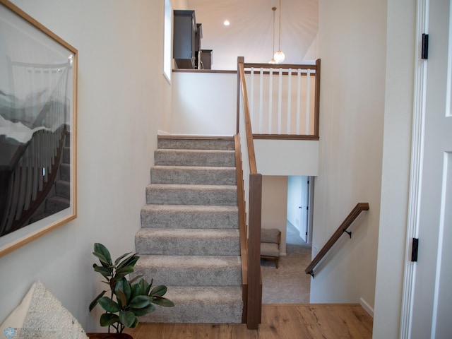 staircase featuring hardwood / wood-style flooring