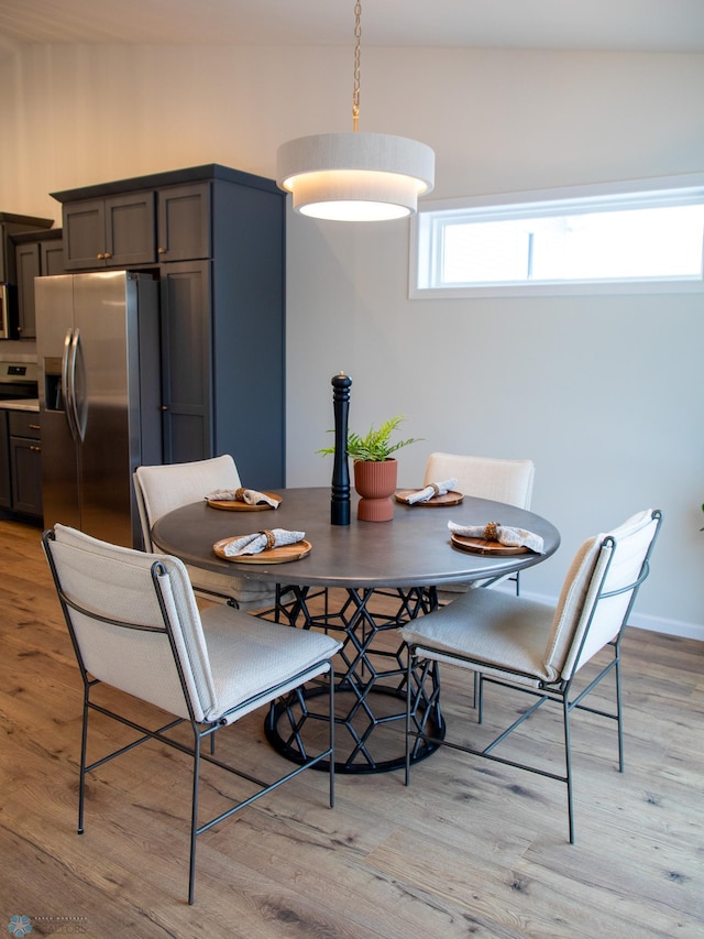 dining area with light hardwood / wood-style flooring