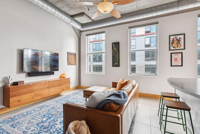 tiled living room featuring a wealth of natural light and ceiling fan