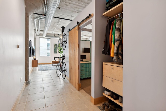 hallway with light tile patterned flooring