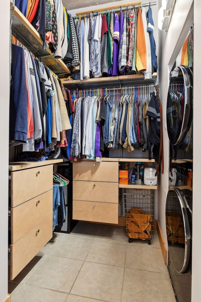 spacious closet featuring light tile patterned floors