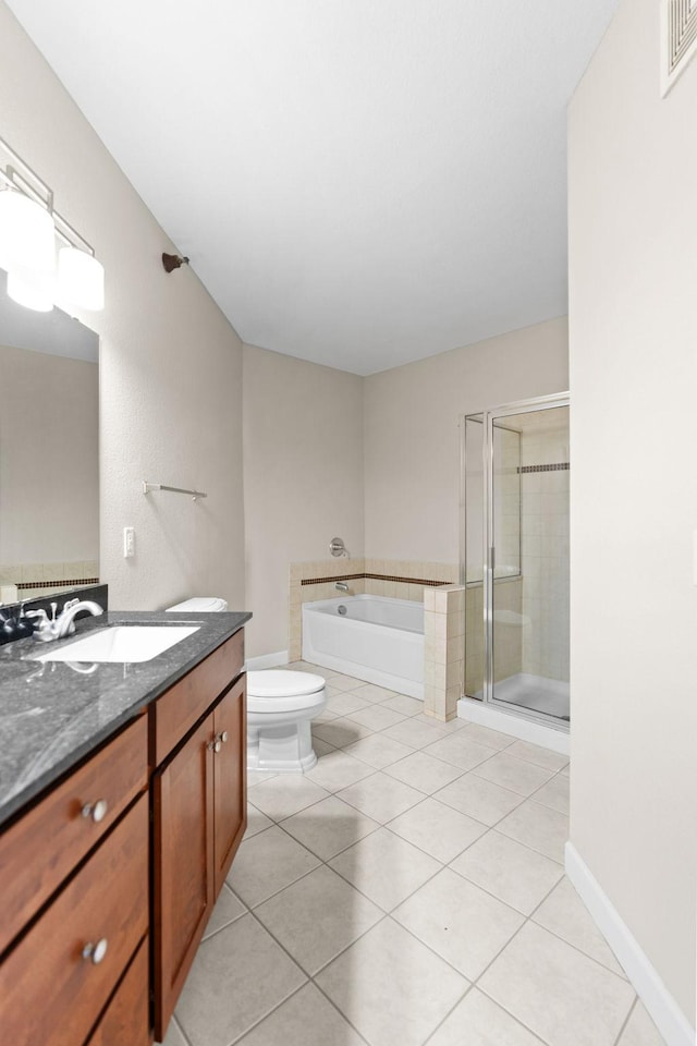 full bathroom with vanity, tile patterned floors, shower with separate bathtub, and toilet