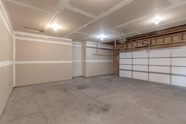 1733 Bassett Dr, Mankato, MN 56001 - garage featuring a garage door opener