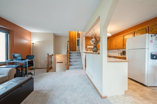 14962 Dodd Blvd, Rosemount, MN 55068 - kitchen with freestanding refrigerator, light countertops, and brown cabinets
