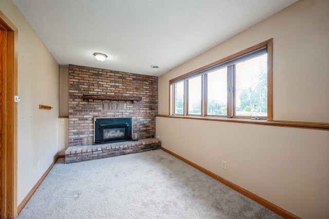14962 Dodd Blvd, Rosemount, MN 55068 - unfurnished living room featuring carpet, a brick fireplace, and baseboards