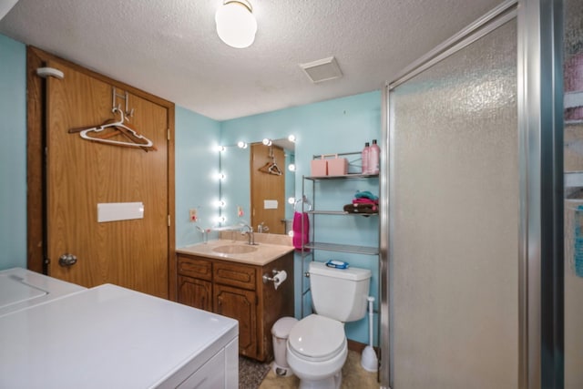 14962 Dodd Blvd, Rosemount, MN 55068 - bathroom with a textured ceiling, a shower stall, toilet, and vanity