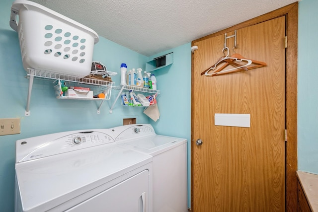 14962 Dodd Blvd, Rosemount, MN 55068 - laundry room with washing machine and clothes dryer and a textured ceiling