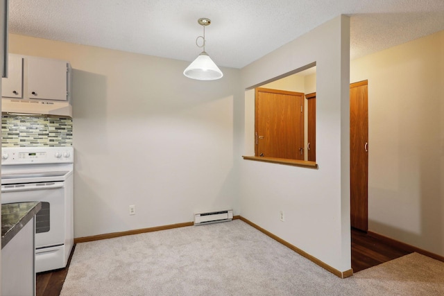 kitchen featuring a baseboard radiator, tasteful backsplash, carpet floors, decorative light fixtures, and electric stove