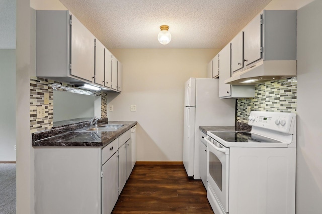 kitchen with backsplash, a textured ceiling, white cabinets, and white appliances