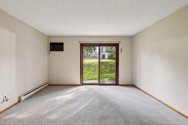 carpeted empty room with a textured ceiling, an AC wall unit, and baseboard heating