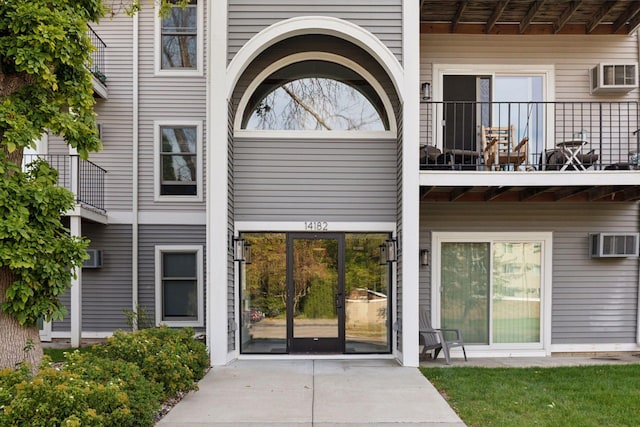 entrance to property featuring a balcony