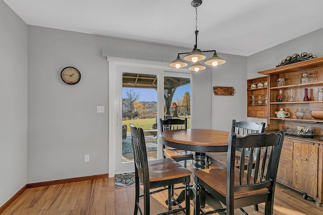 dining space with light hardwood / wood-style floors