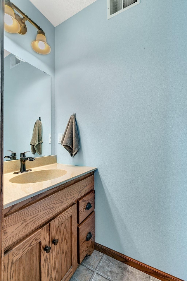 bathroom featuring tile patterned floors and vanity