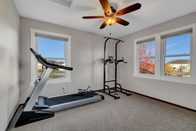 exercise room with carpet floors and ceiling fan