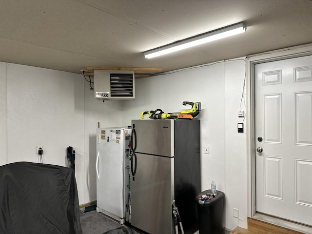 kitchen featuring stainless steel fridge and white fridge