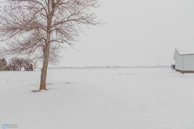 view of yard layered in snow