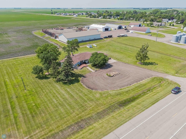 birds eye view of property with a rural view