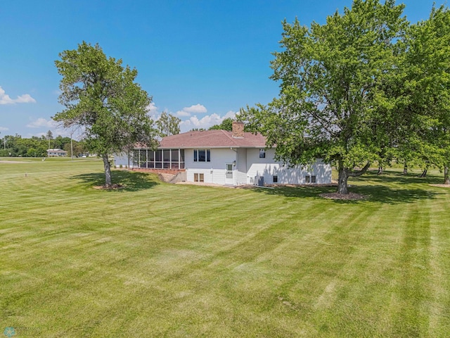 view of yard with a sunroom