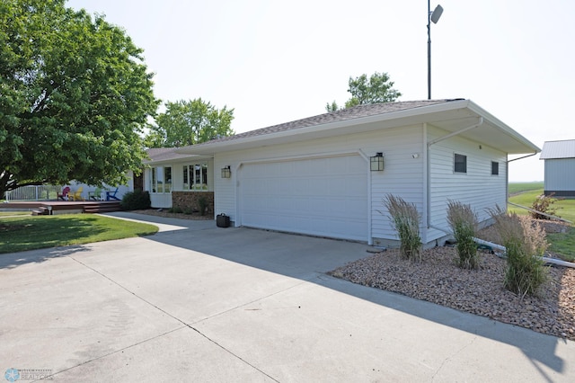 single story home featuring a garage