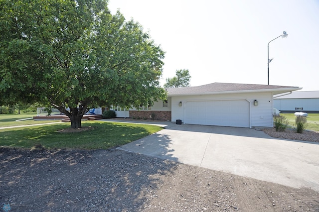 view of front of house featuring a garage and a front lawn