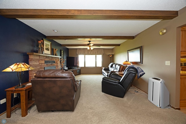 living room with ceiling fan, carpet flooring, beam ceiling, and a textured ceiling