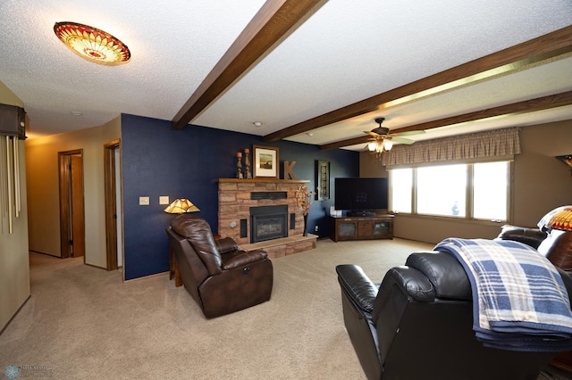 living room with a stone fireplace, light colored carpet, a textured ceiling, and beam ceiling