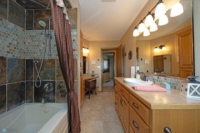 bathroom featuring tasteful backsplash, vanity, and shower / tub combo with curtain