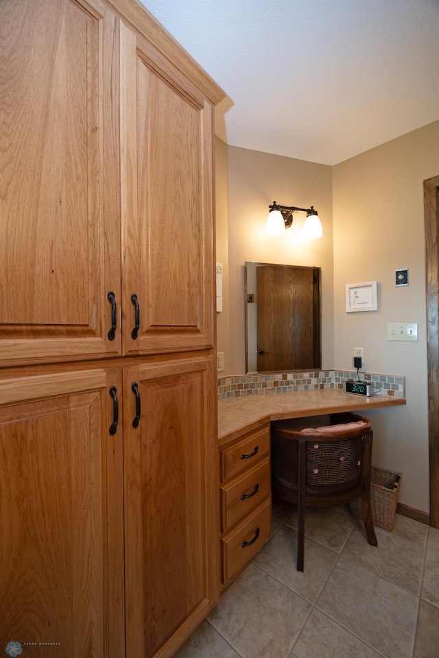 bathroom featuring tasteful backsplash and tile patterned floors