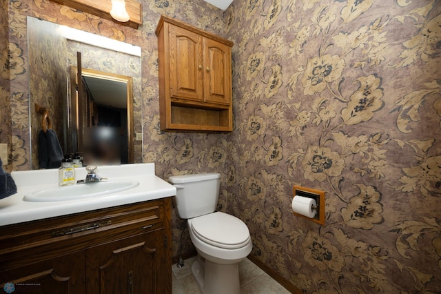 bathroom featuring tile patterned floors, toilet, and vanity