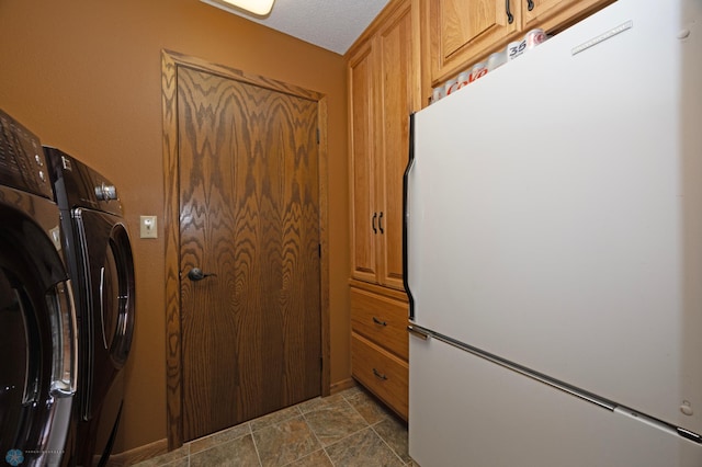 laundry area with cabinets and separate washer and dryer