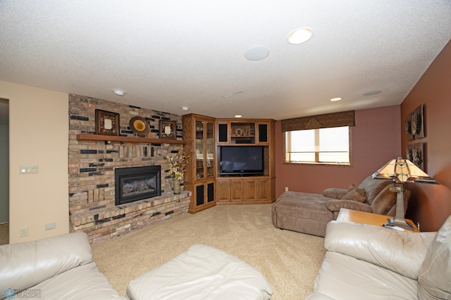 carpeted living room with a fireplace and a textured ceiling