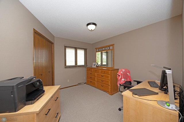 home office with light colored carpet