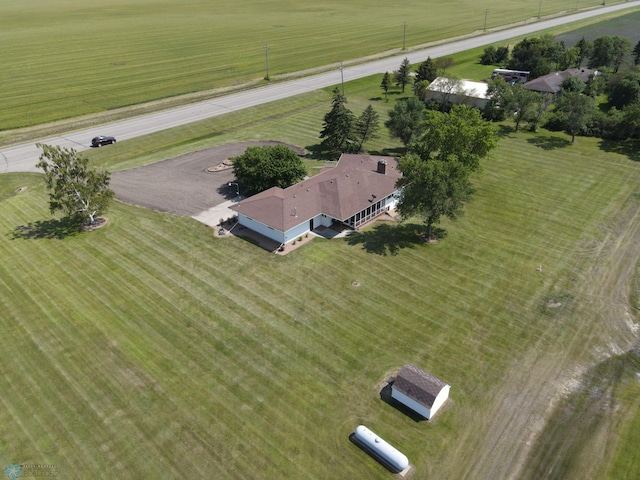 birds eye view of property with a rural view