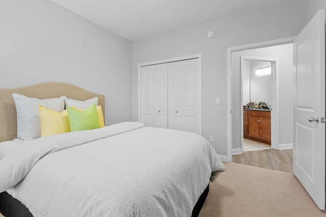 carpeted bedroom featuring a closet