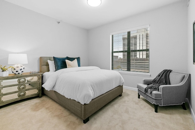 bedroom with light colored carpet