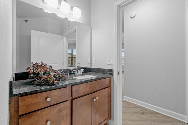 bathroom featuring vanity and hardwood / wood-style flooring