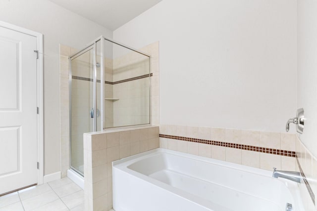 bathroom featuring independent shower and bath and tile patterned flooring