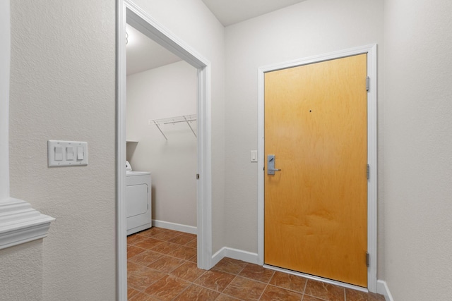 washroom with washer / clothes dryer