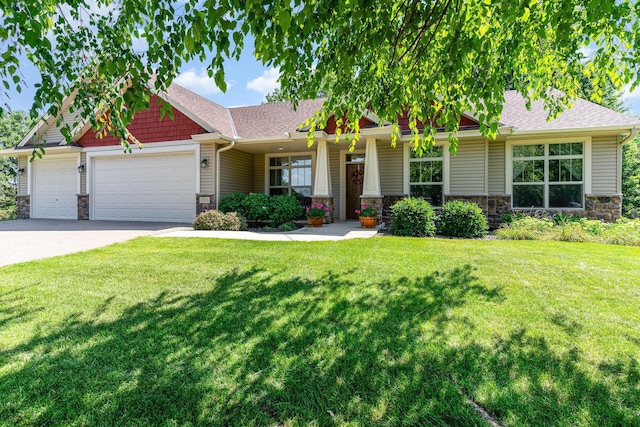 craftsman-style home featuring a garage and a front yard