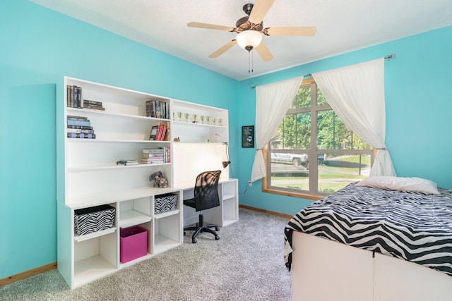 bedroom featuring ceiling fan and light carpet