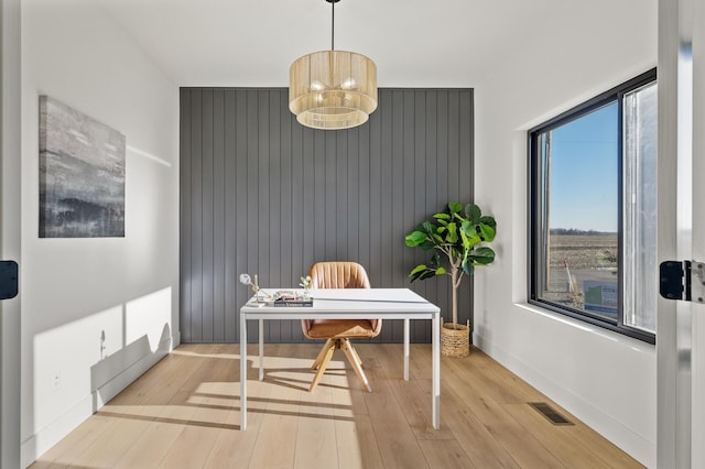 office area with light hardwood / wood-style floors