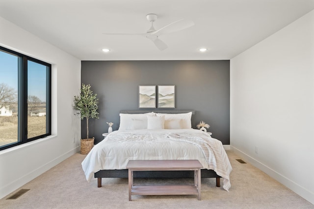 carpeted bedroom with ceiling fan