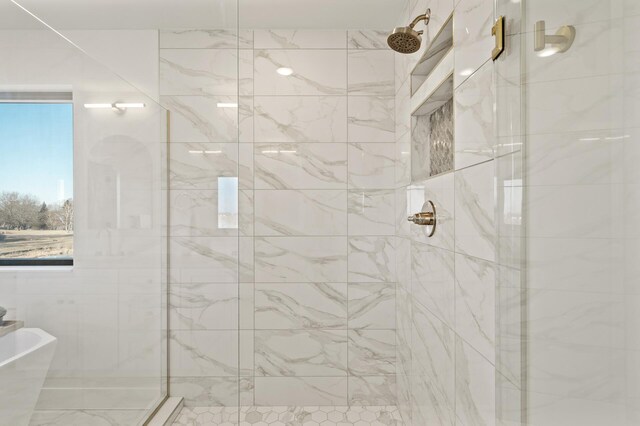 bathroom featuring shower with separate bathtub