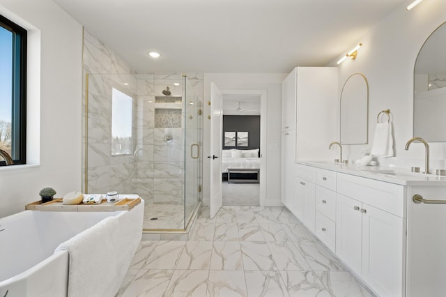 bathroom with vanity and independent shower and bath