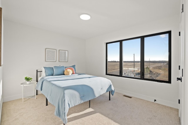 bedroom with light carpet