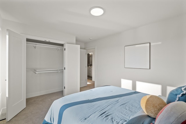 carpeted bedroom featuring a closet