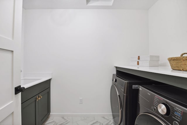 laundry area featuring cabinets and independent washer and dryer